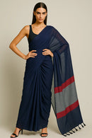 ROYAL ECLIPS | Mul Cotton | Indidha Saree -  Buy Royal Eclipse Saree – Majestic Black Drape  Our stunning mul cotton saree features a deep midnight blue body with a rich maroon stripe border, offering the perfect blend of comfort and style.