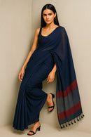 ROYAL ECLIPS | Mul Cotton | Indidha Saree -  Buy Royal Eclipse Saree – Majestic Black Drape  Our stunning mul cotton saree features a deep midnight blue body with a rich maroon stripe border, offering the perfect blend of comfort and style.