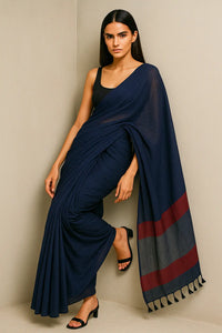 ROYAL ECLIPS | Mul Cotton | Indidha Saree -  Buy Royal Eclipse Saree – Majestic Black Drape  Our stunning mul cotton saree features a deep midnight blue body with a rich maroon stripe border, offering the perfect blend of comfort and style.