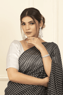 PRISHA | Mul Cotton | Indidha Saree -  Prisha: Pure Mul Cotton Handloom Saree | Indidha  Shop 'Prisha' – a breathable pure mul cotton saree in elegant black & white stripes. Lightweight, handloom-woven & perfect for all-day wear.