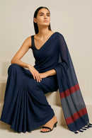 ROYAL ECLIPS | Mul Cotton | Indidha Saree -  Buy Royal Eclipse Saree – Majestic Black Drape  Our stunning mul cotton saree features a deep midnight blue body with a rich maroon stripe border, offering the perfect blend of comfort and style.
