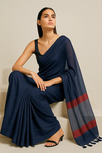 ROYAL ECLIPS | Mul Cotton | Indidha Saree -  Buy Royal Eclipse Saree – Majestic Black Drape  Our stunning mul cotton saree features a deep midnight blue body with a rich maroon stripe border, offering the perfect blend of comfort and style.