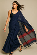 ROYAL ECLIPS | Mul Cotton | Indidha Saree -  Buy Royal Eclipse Saree – Majestic Black Drape  Our stunning mul cotton saree features a deep midnight blue body with a rich maroon stripe border, offering the perfect blend of comfort and style.