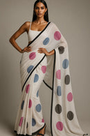 BREEZY DOTS | Mul Cotton | Indidha Saree -  Lightweight Mul Cotton Saree with Polka Dots – Shop Now!  Looking for an easy-to-drape saree? This breathable mul cotton saree with vibrant polka dots and a timeless black border is just what you need!