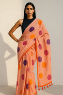 COZY DOTS | Mul Cotton | Indidha Saree -  Cozy Dots – Peach Handloom Mul Cotton Saree with Polka Dots | Indidha  Explore the Cozy Dots saree by Indidha – a peach mul cotton handloom drape with playful polka dots and tassels. Ultra-soft, breathable, and blouse-free. Shop now!