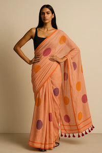 COZY DOTS | Mul Cotton | Indidha Saree -  Cozy Dots – Peach Handloom Mul Cotton Saree with Polka Dots | Indidha  Explore the Cozy Dots saree by Indidha – a peach mul cotton handloom drape with playful polka dots and tassels. Ultra-soft, breathable, and blouse-free. Shop now!