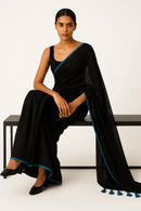 SERENITY BREEZE | Mul Cotton | Indidha Saree -  Serenity Breeze – Black Mul Cotton Saree | Indidha  Shop Serenity Breeze, a handcrafted black mul cotton saree with blue edging & tassels. Lightweight, breathable, and effortlessly elegant. Only at Indidha.