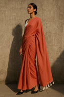 Ember Drape | Handloom Mul Cotton | Indidha Saree -  Ember Drape – Terracotta Red Handloom Mul Cotton Saree with Tassels | Indidha  Discover Ember Drape, a handloom mul cotton saree in terracotta red with white tassels. Ultra-soft, breathable, and elegant. No blouse included. Color may slightly vary due to screen settings.