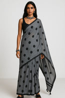 MONOCHROME MAGIC | Mul Cotton | Indidha Saree -  Minimalist Grey Saree with Black Polka Dots  This mul cotton saree in soft grey with playful black polka dots combines comfort with timeless style. It is perfect for effortless everyday wear.