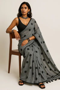 MONOCHROME MAGIC | Mul Cotton | Indidha Saree -  Minimalist Grey Saree with Black Polka Dots  This mul cotton saree in soft grey with playful black polka dots combines comfort with timeless style. It is perfect for effortless everyday wear.
