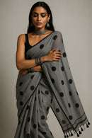 MONOCHROME MAGIC | Mul Cotton | Indidha Saree -  Minimalist Grey Saree with Black Polka Dots  This mul cotton saree in soft grey with playful black polka dots combines comfort with timeless style. It is perfect for effortless everyday wear.