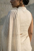 Woman wearing a white slub cotton saree