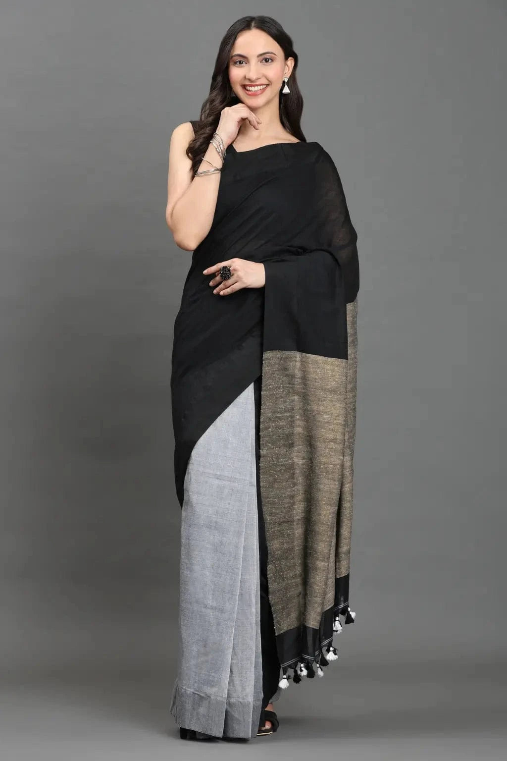 WOVEN TIDES | Pure Cotton | Indidha Saree -  Feel the Soft Pure Cotton Saree | Indidha   Shop our elegant pure cotton saree in black & grey. Feel the soft, breathable fabric with tassel details. Style your modern ethnic look now!