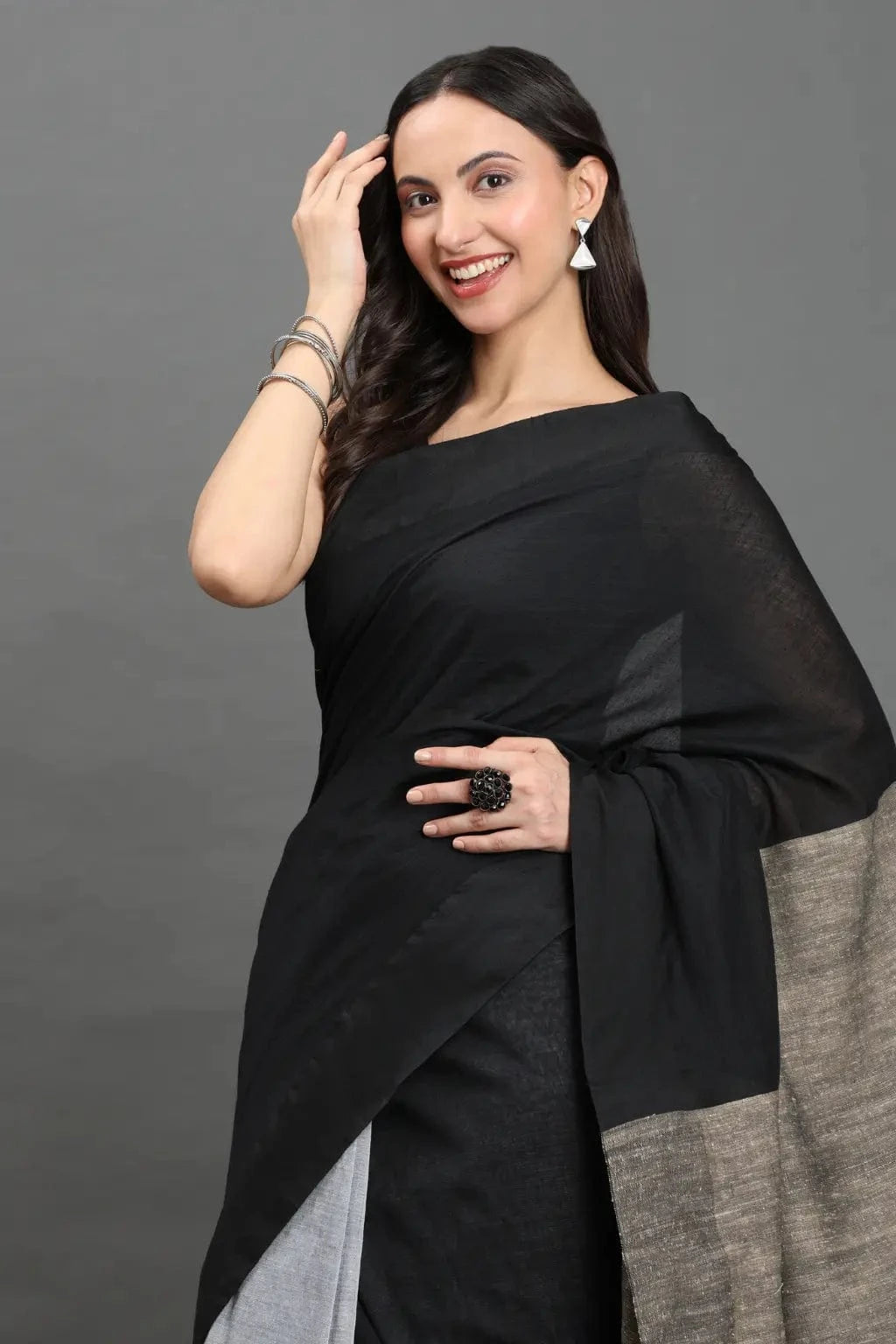 WOVEN TIDES | Pure Cotton | Indidha Saree -  Feel the Soft Pure Cotton Saree | Indidha   Shop our elegant pure cotton saree in black & grey. Feel the soft, breathable fabric with tassel details. Style your modern ethnic look now!