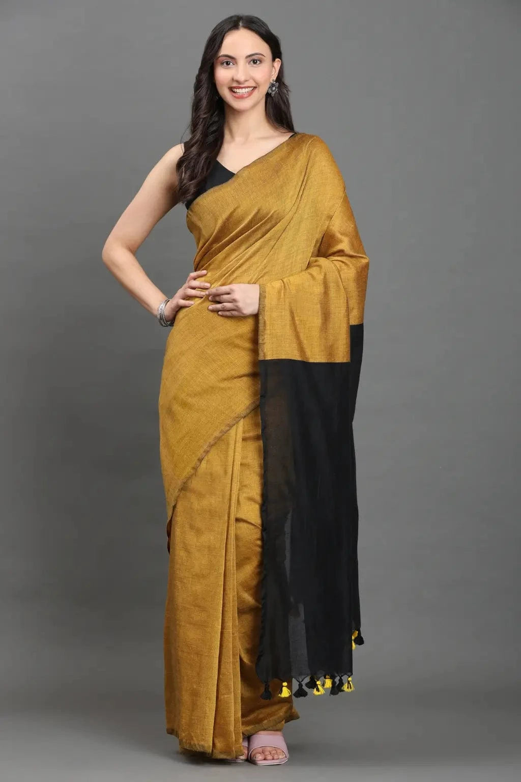 Zafran Noir | Cotton | Indidha Saree -  Mustard Handloom Cotton Saree with Black Pallu | Indidha  Elevate your everyday style with this mustard handloom cotton saree. Bold black pallu, featherlight feel—perfect for work and beyond. Shop now at Indidha!