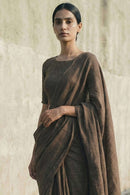 Textured slub cotton fabric in baked earth saree for breathable comfort