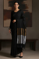 Modern black cotton saree styled for office and evening wear