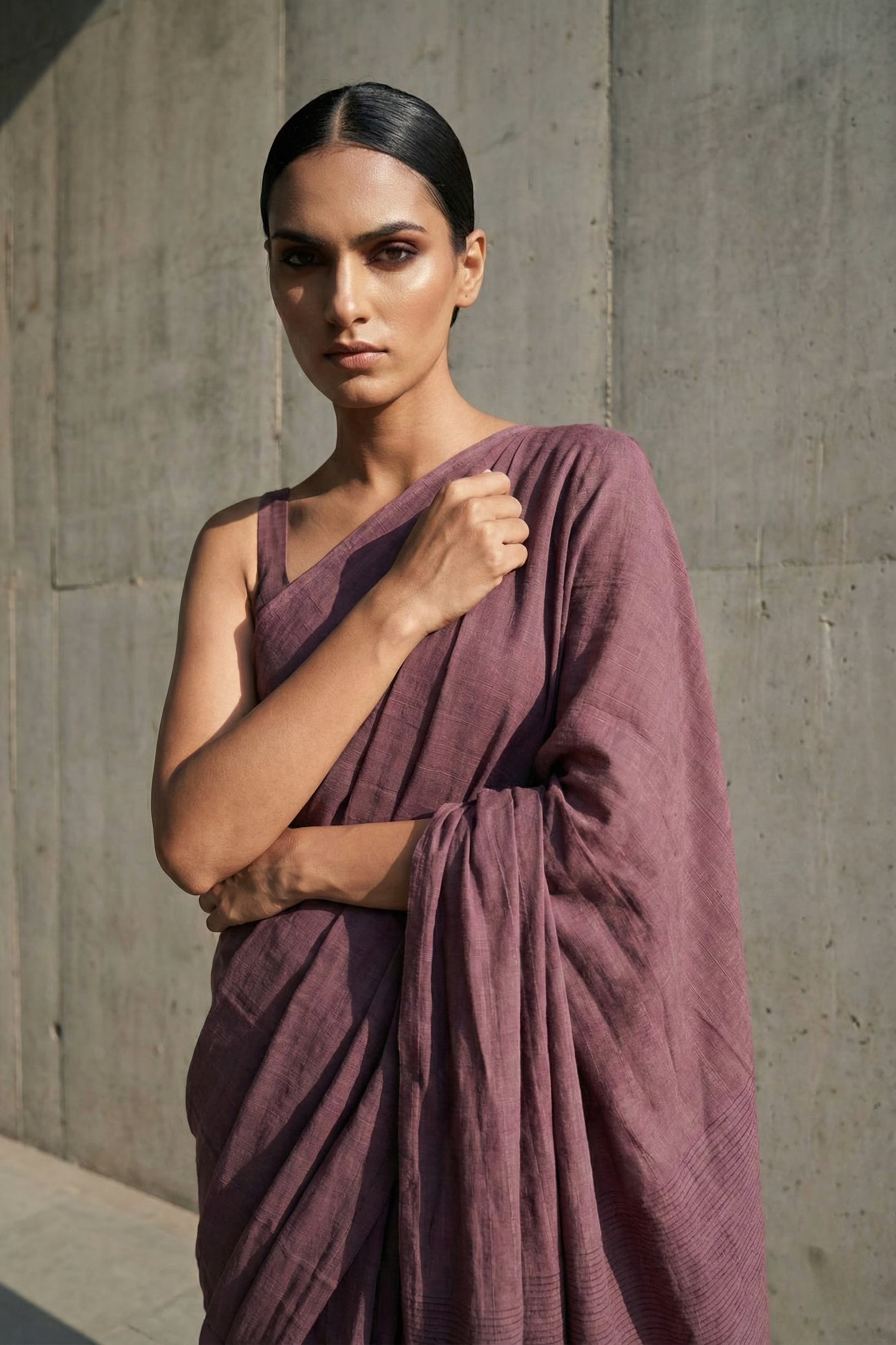 Elegant dusty mauve cotton saree styled for modern festive and casual wear