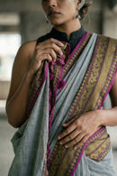 The Slate Rebellion steel grey mul cotton saree with magenta and antique gold border by Indidha